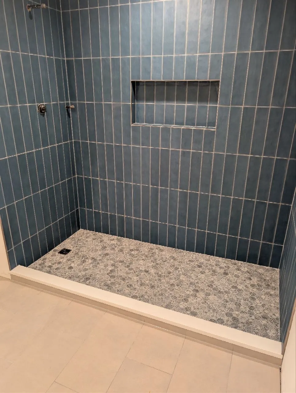 Blue porcelain shower walls in vertical stack bond with recessed niche, Highland Park IL
