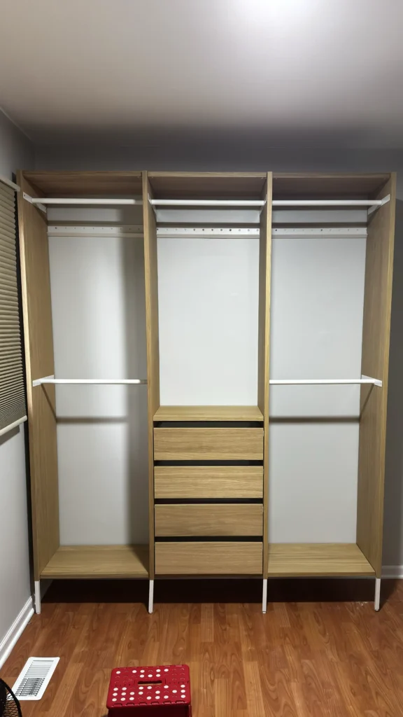 IKEA AURDAL seven-section closet installation with hanging rods and central drawers in Mount Prospect, Illinois