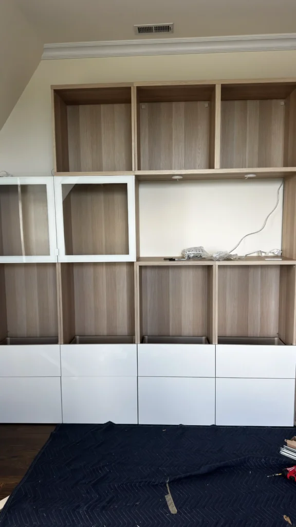 IKEA BESTÅ wall unit frames being assembled and positioned in Palatine, IL.