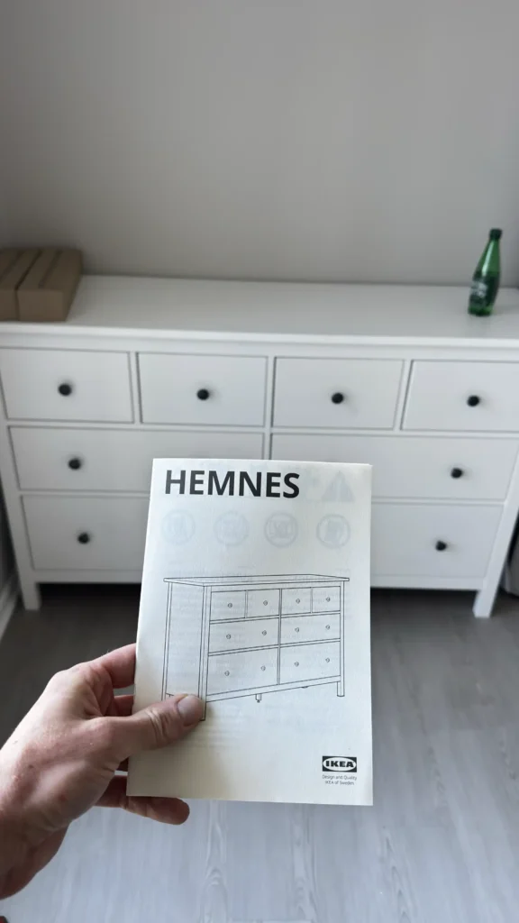 IKEA HEMNES white eight-drawer dresser assembled in a Palatine bedroom, with assembly instructions in the foreground