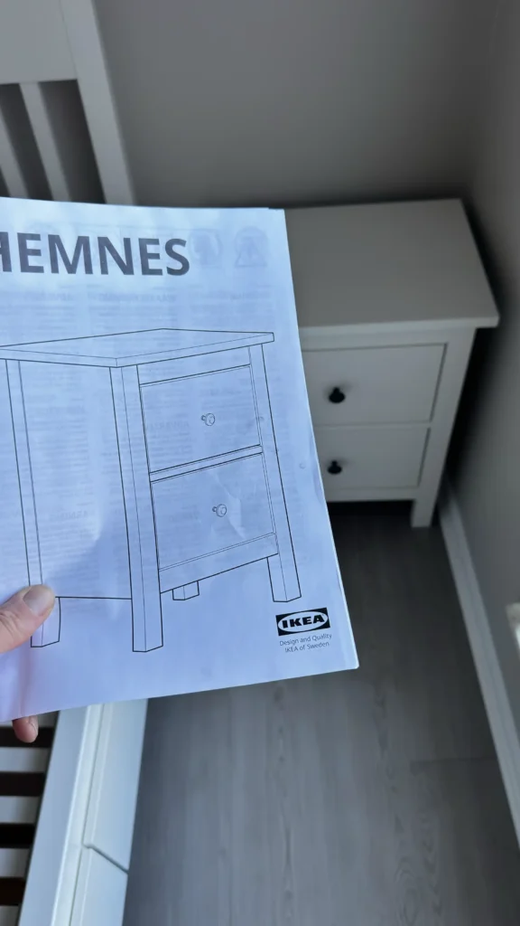 White IKEA HEMNES two-drawer nightstand assembled in a Palatine bedroom