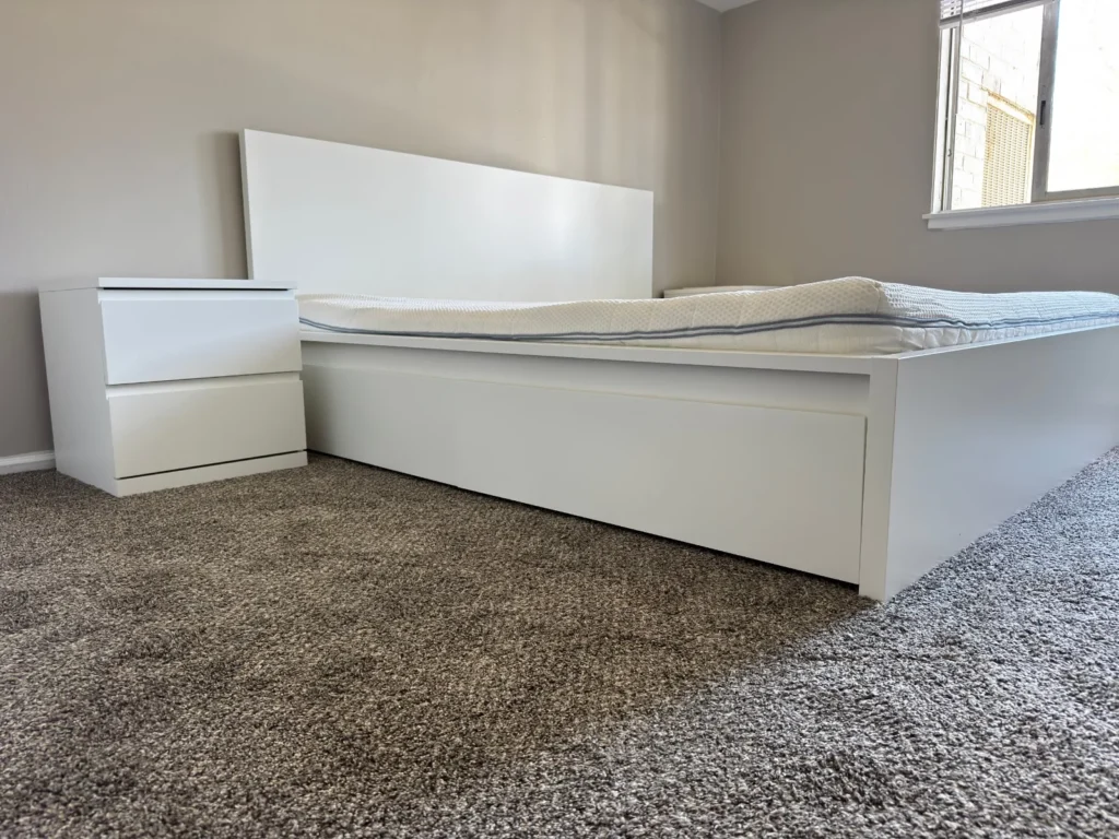 White IKEA MALM bed with storage and MALM nightstand assembled in Arlington Heights