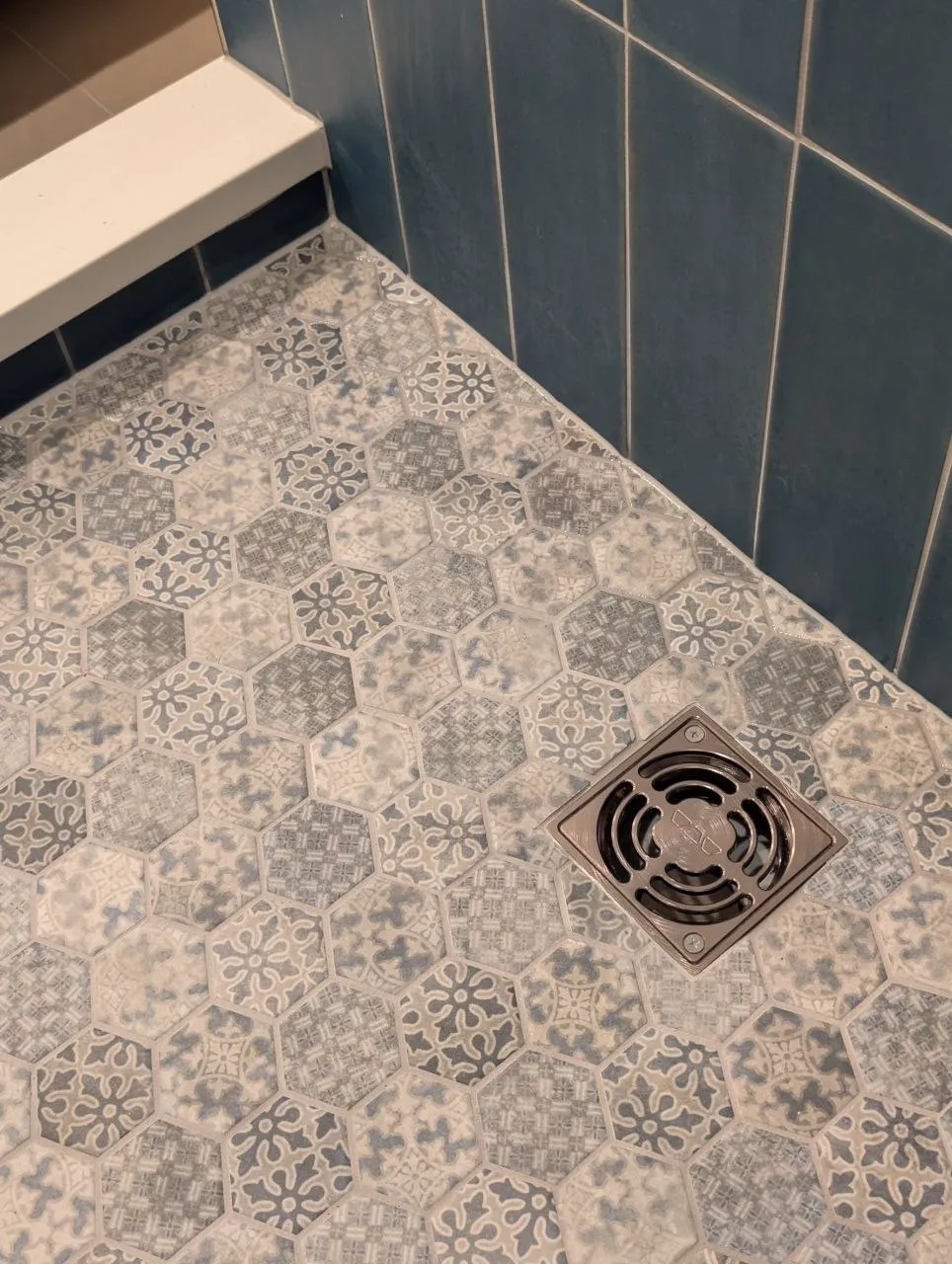 Close-up of patterned hexagon mosaic tile and drain, Highland Park IL