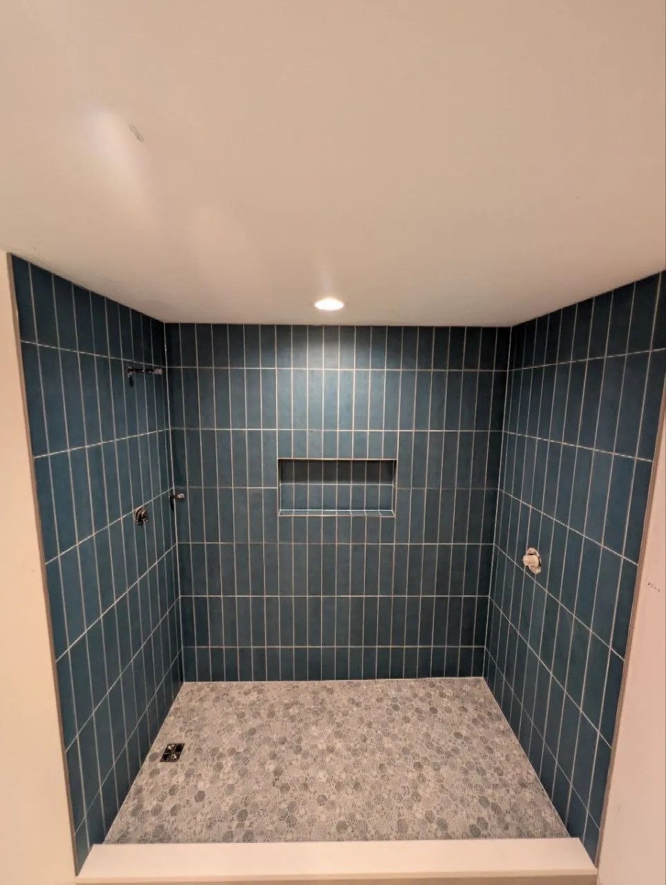 Blue porcelain wall tile with patterned hexagon mosaic shower floor, Highland Park IL