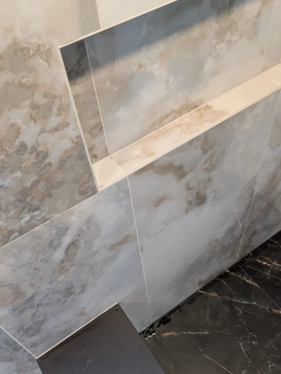 Detail of shower niche cut into 24x48 porcelain tile, Naperville IL
