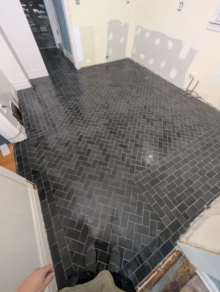 Wide view of slate herringbone kitchen floor with heated subfloor, Barrington IL