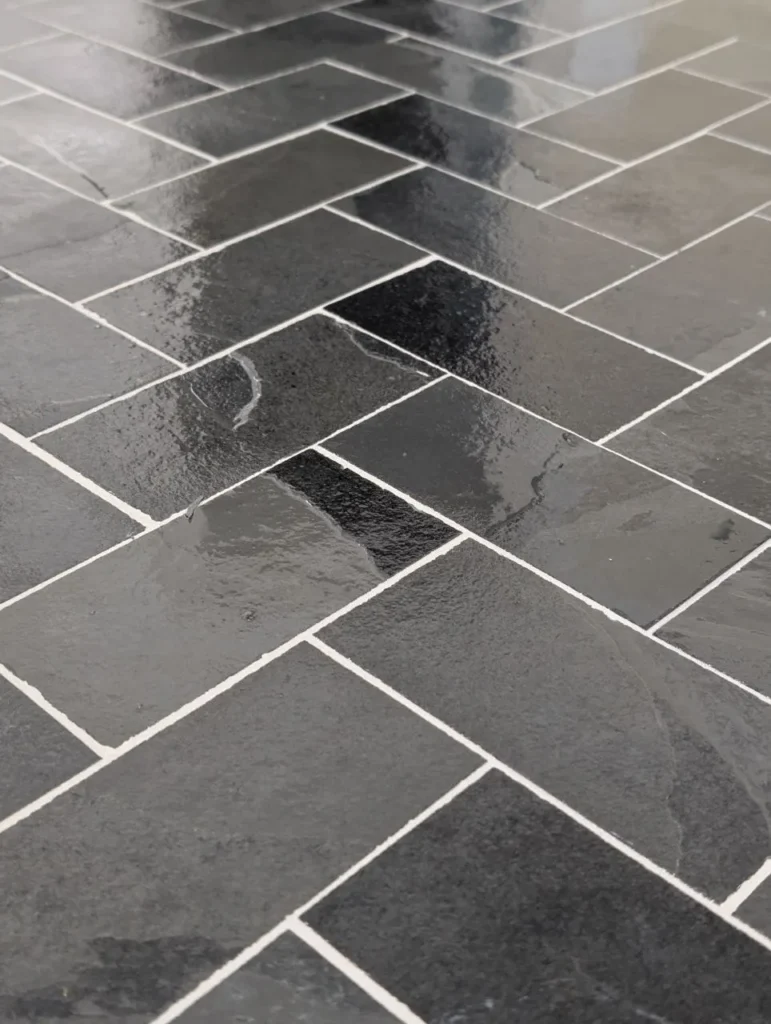 Close-up of sealed natural slate 3x6 tile with white grout, Barrington IL
