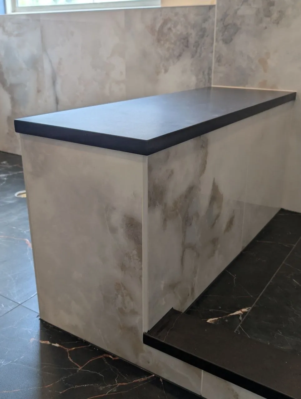 Tiled shower bench with slab top in porcelain bathroom remodel, Naperville IL